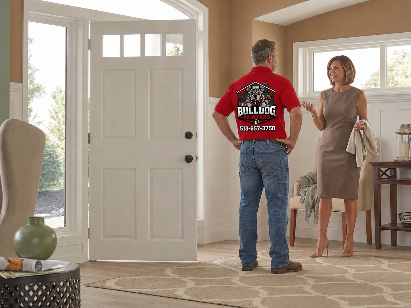 A Bulldog Painters estimator being welcomed into a home by the owner at the front door