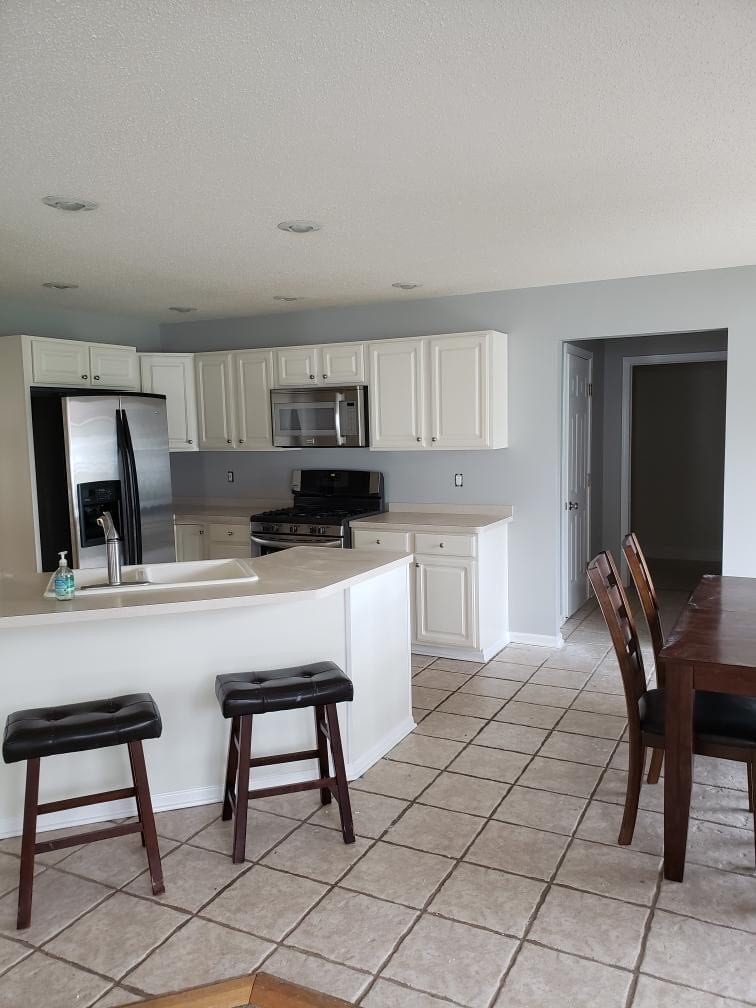 Island and dining area — after