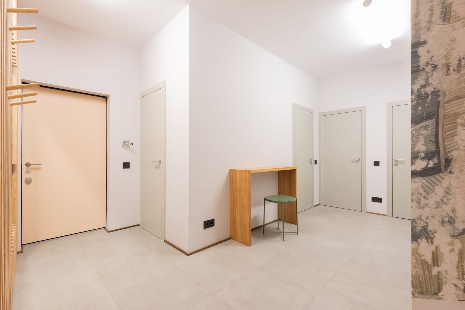 A six-panel interior door and frame finished in white enamel